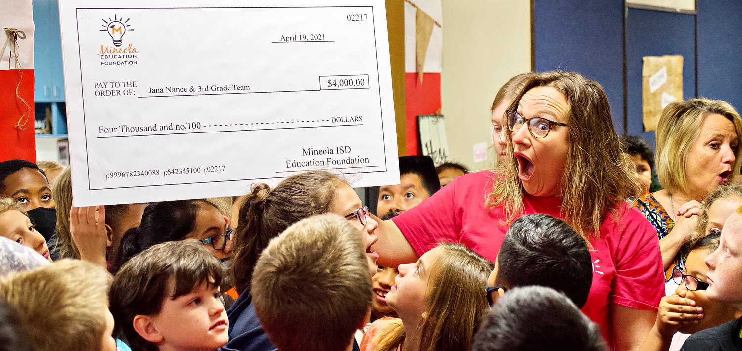 Mineola Elementary School teacher Jana Nance reacts to the third grade team receiving a Mineola ISD Education Foundation grant that will help buy lockers and storage units. The grants were awarded last Thursday during the prize patrol, which surprised teachers with the announcements.